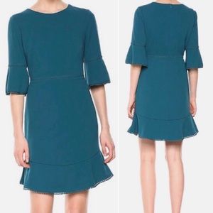 Betsey Johnson, size 12, turquoise dress with 3/4 length sleeves.